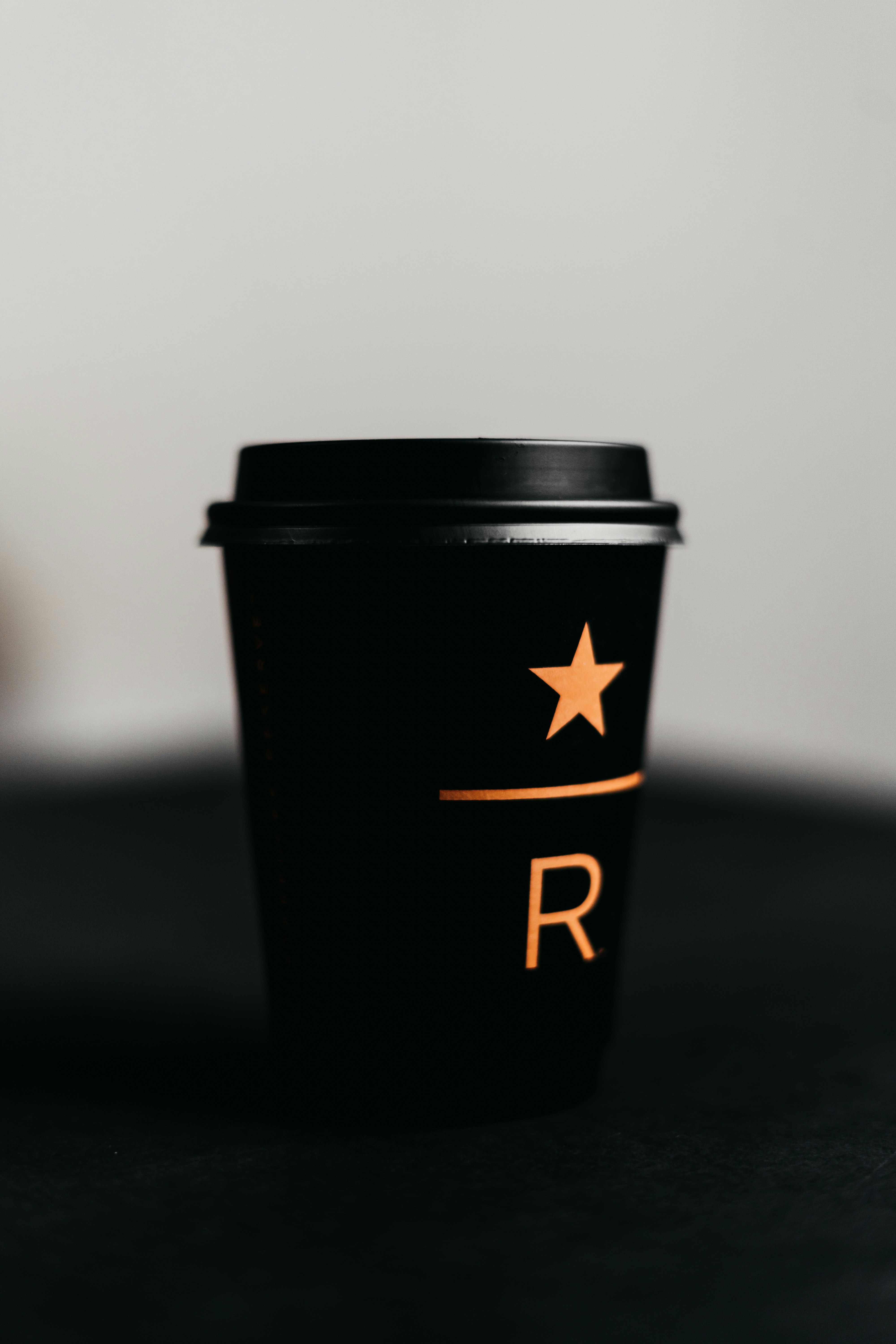 black and orange plastic cup